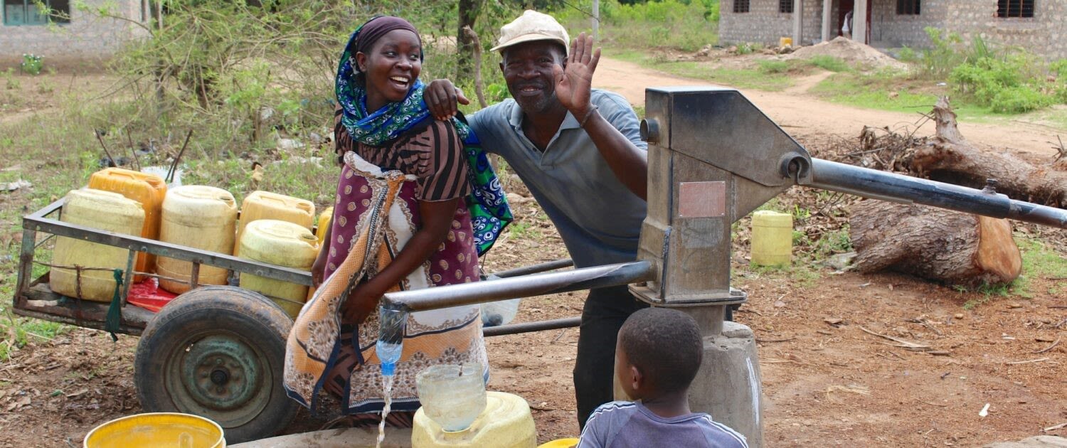 A family in Kenya accessing water from a tap