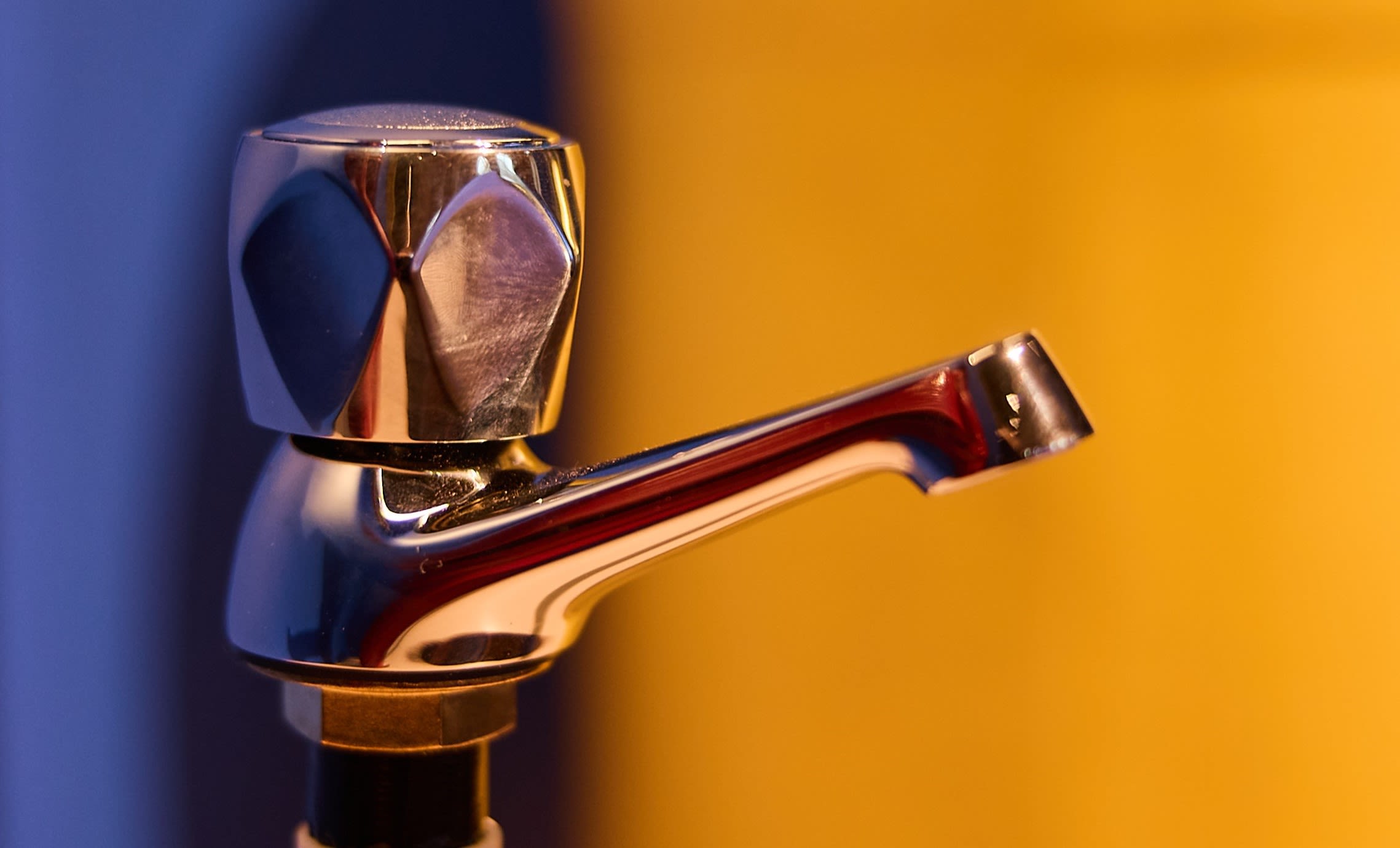 A family in Kenya accessing water from a tap