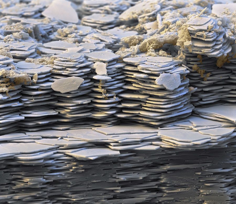 Hexagonal plates stacked in sheets, made of calcium carbonate