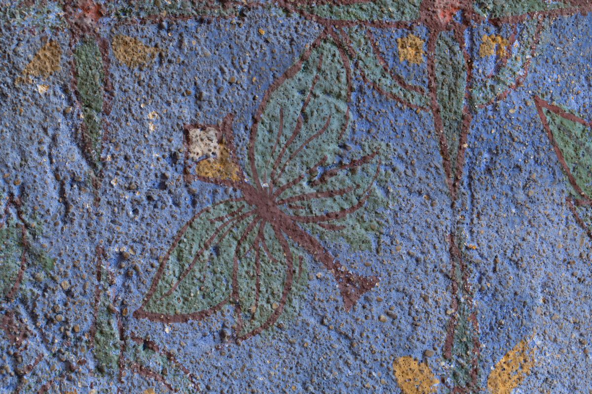 Leaves painted on a blue background on the Westwood room walls
