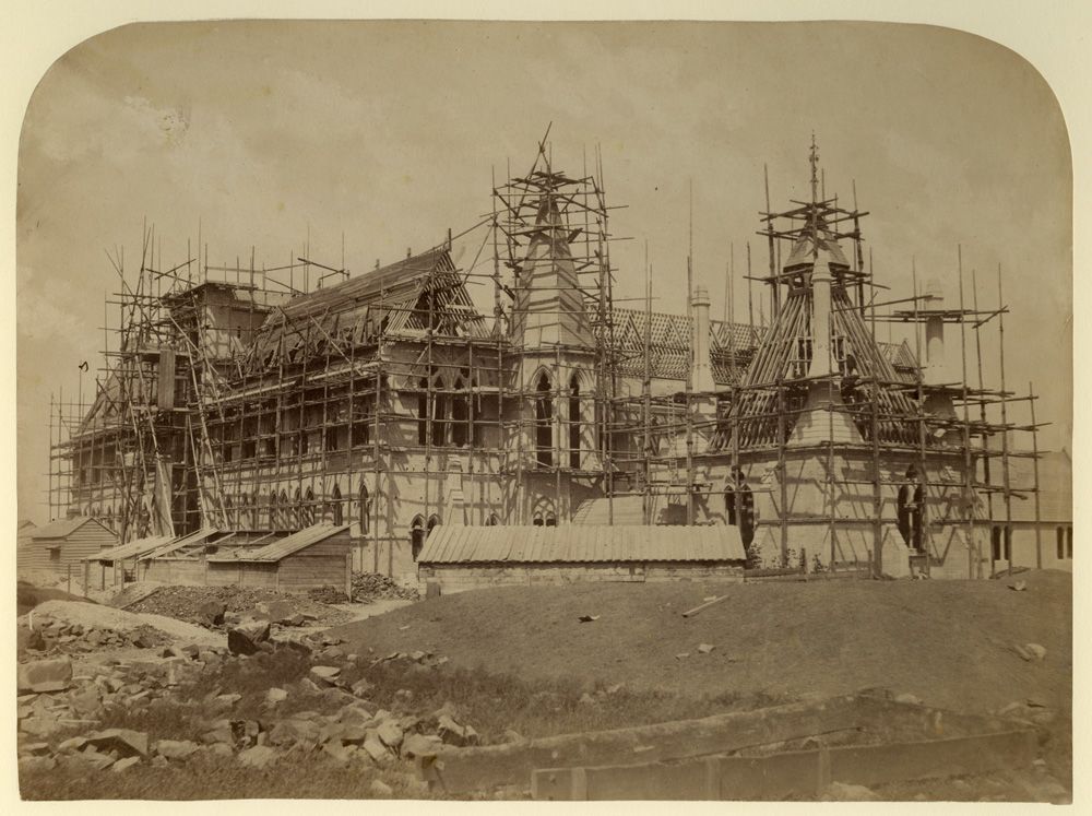 Black and white photograph showing the building with scaffolding