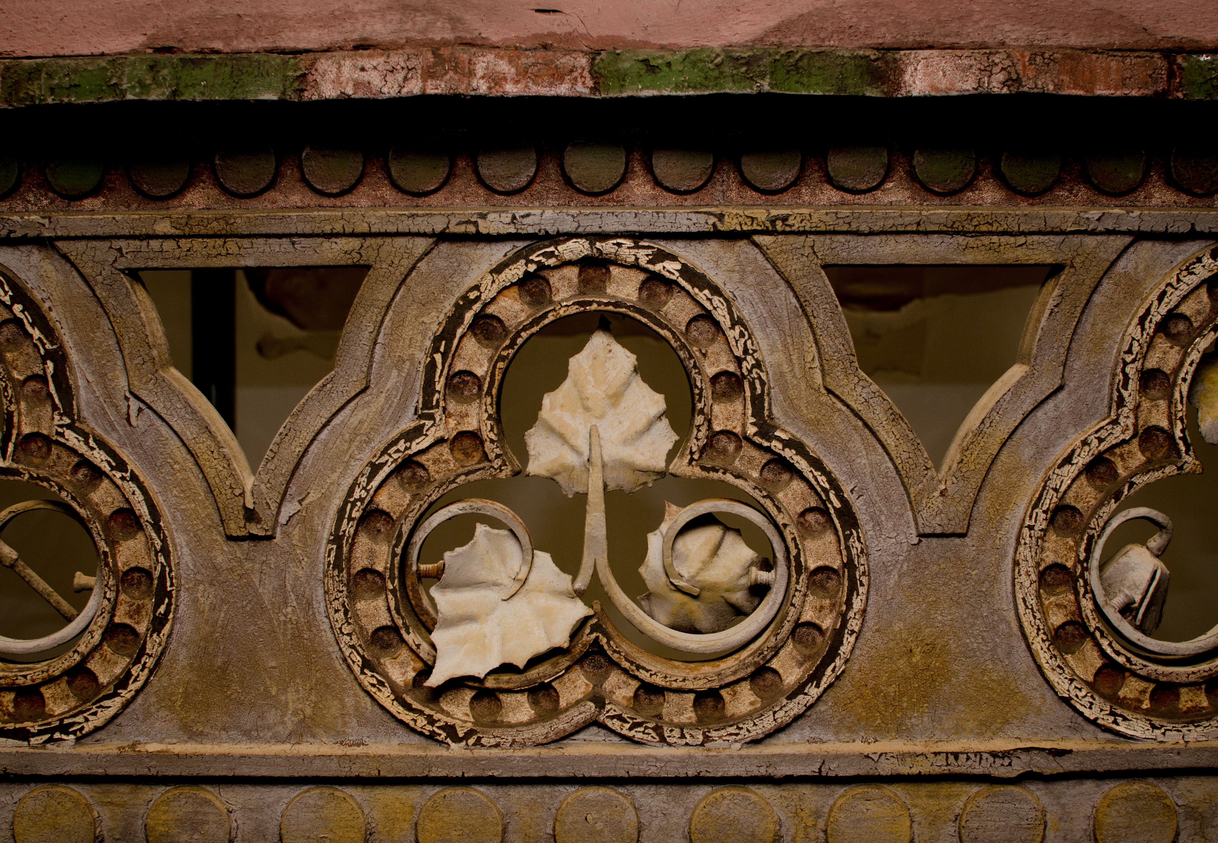 Wrought iron leaf decoration on central court roof 