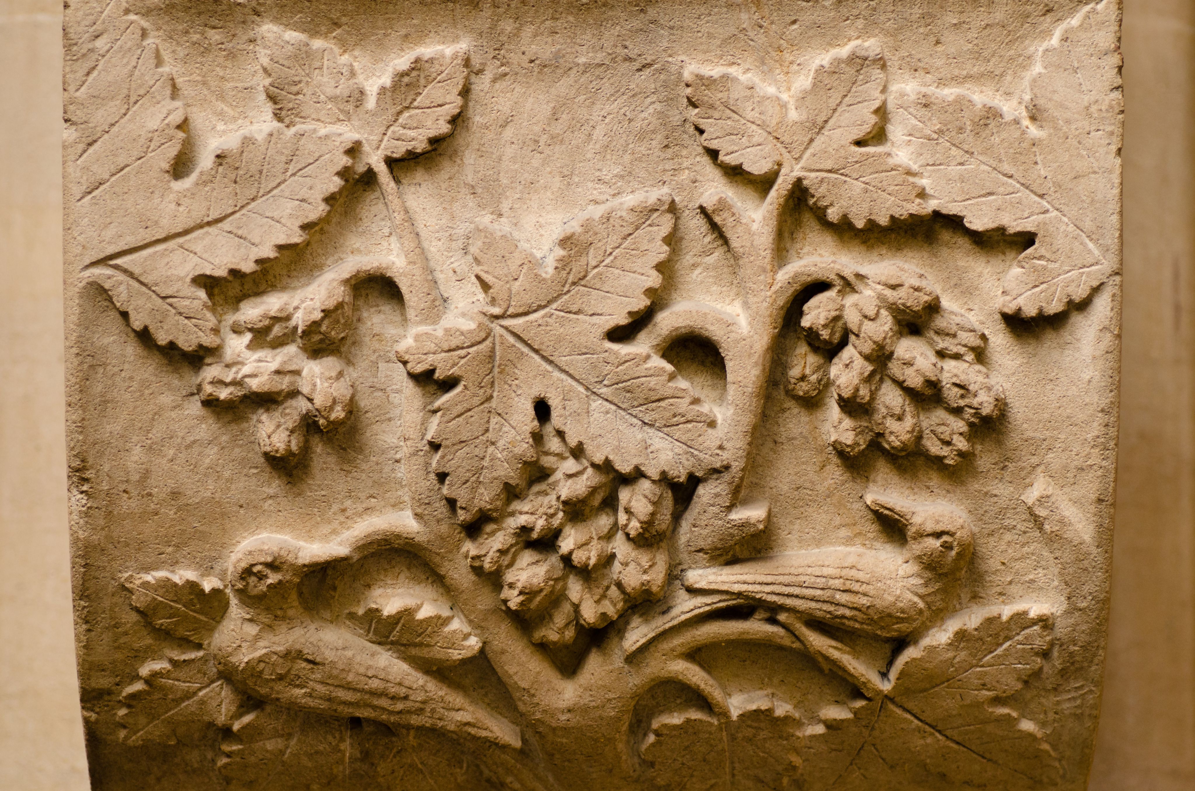 Carving of birds and foliage