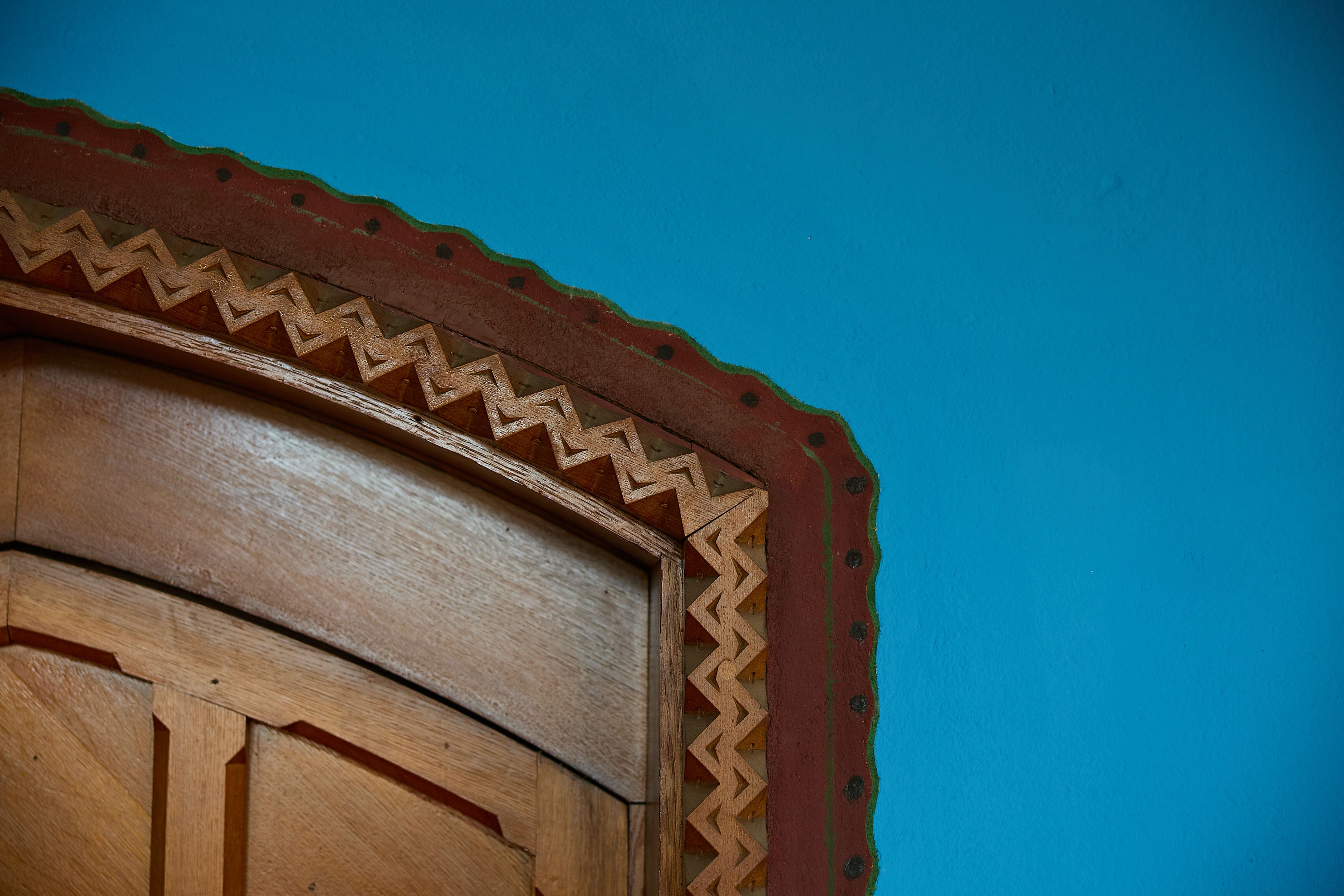 geometric painted decoration around oak door