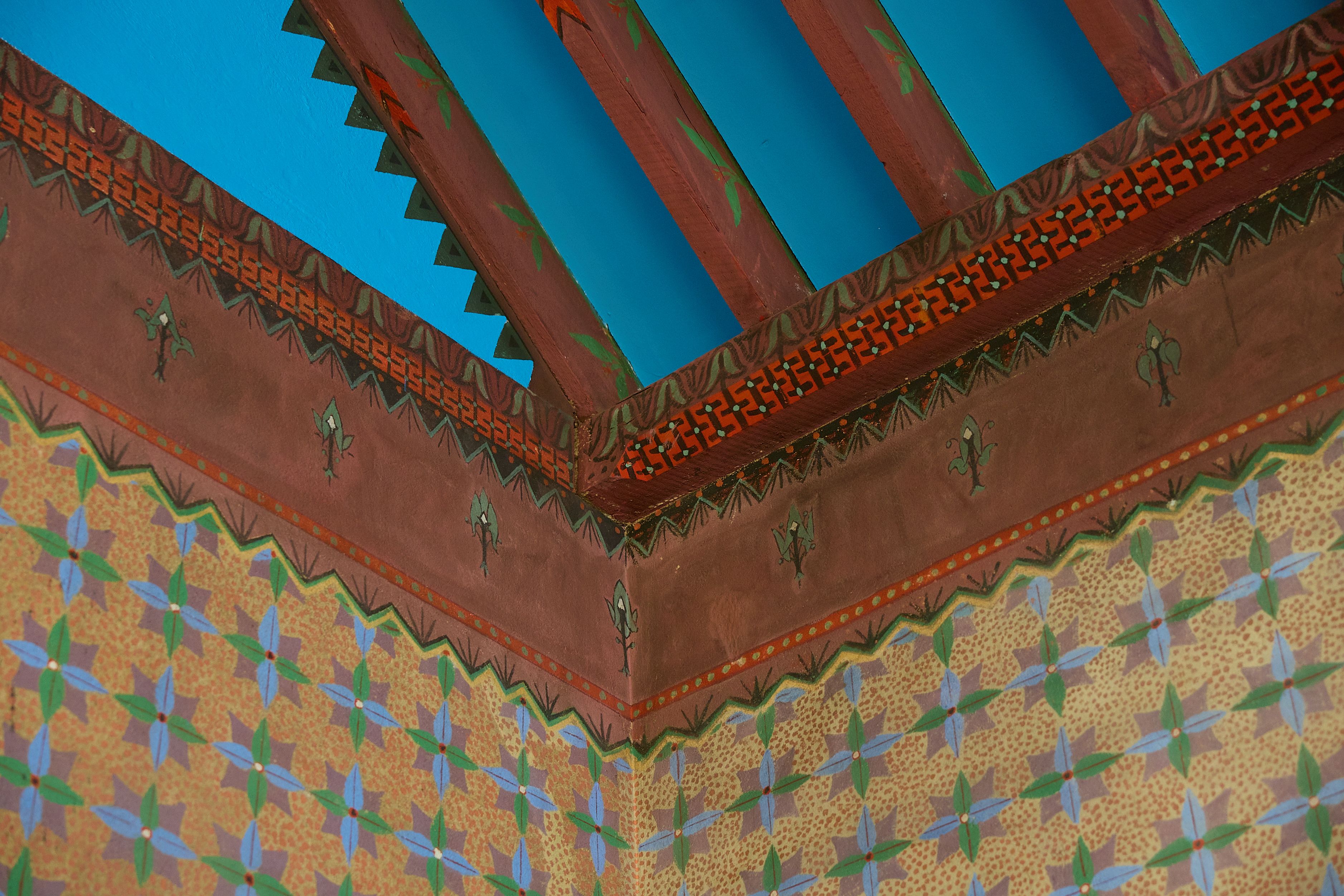 Painted decoration at the top of walls